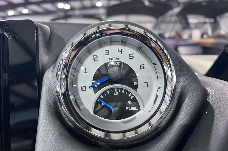 Slide: The Image of Close-up of 2026 Sylvan L3 LZ DH tachometer and fuel gauge in a sleek dashboard. - 10