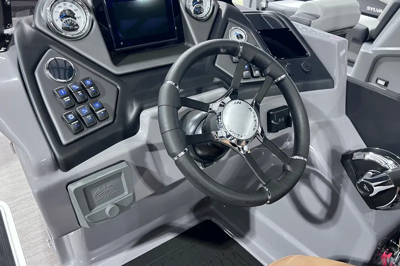 Slide: The Image of Steering console of 2026 Sylvan L3 LZ DH boat with modern controls and dashboard. - 9