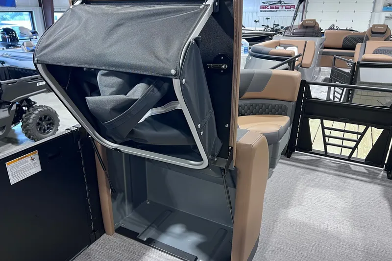 Slide: The Image of 2026 Sylvan L3 LZ DH boat interior with storage compartment and seating. - 22