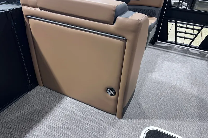 Slide: The Image of Interior of 2026 Sylvan L3 LZ DH boat with tan seating and gray flooring. - 21