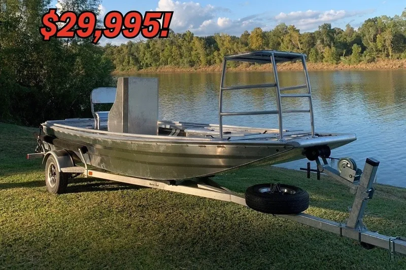 The Image of 2023 Riverside 18' Custom Mud Boat for sale, priced at $29,995, near scenic lake. - 1