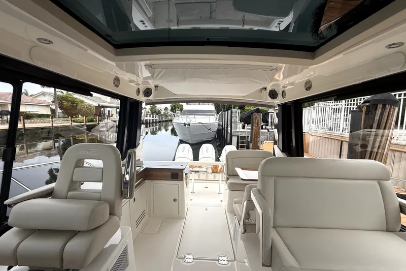 Slide: The Image of Interior view of 2024 Boston Whaler 405 Conquest boat, showcasing luxurious seating and sleek design. - 15