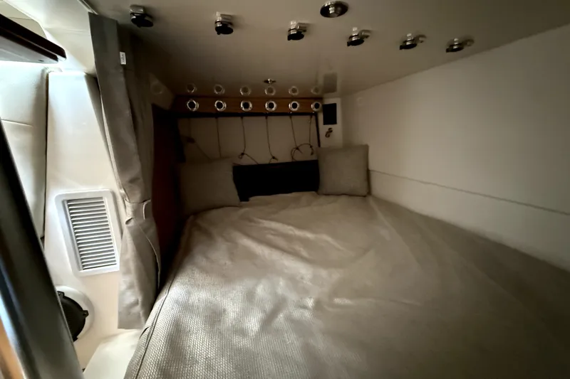 Slide: The Image of Cozy cabin interior of 2024 Boston Whaler 405 Conquest with comfortable bedding and modern fixtures. - 20