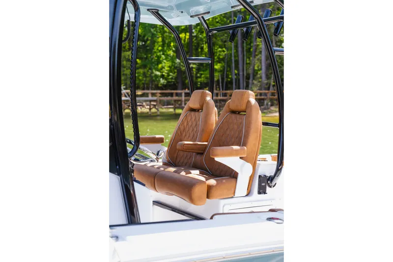 Slide: The Image of 2026 Sea Hunt Ultra 305SE boat with luxurious tan leather seats. - 33