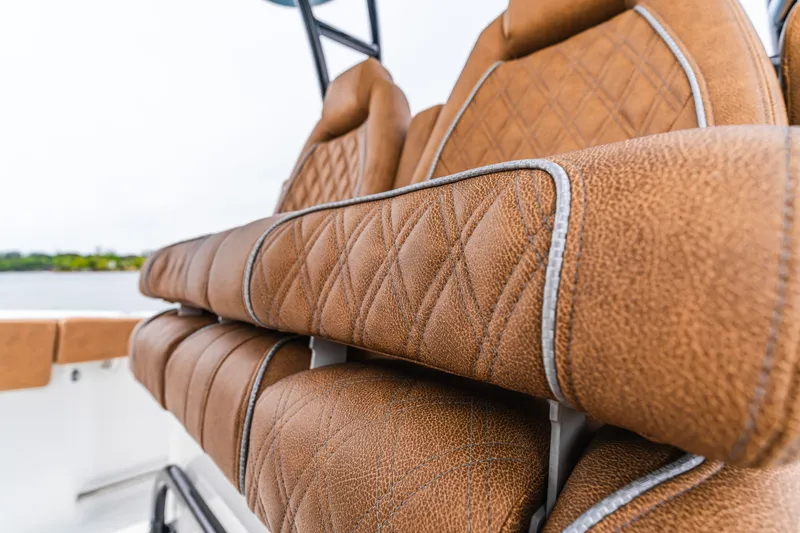 Slide: The Image of Luxurious brown leather seating on 2026 Sea Hunt Ultra 305SE boat. - 17