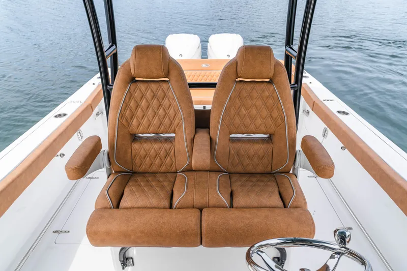 Slide: The Image of Luxurious seating on 2026 Sea Hunt Ultra 305SE boat, featuring diamond-stitched upholstery. - 14