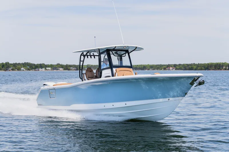 Slide: The Image of 2026 Sea Hunt Ultra 305SE boat cruising on open water. - 32