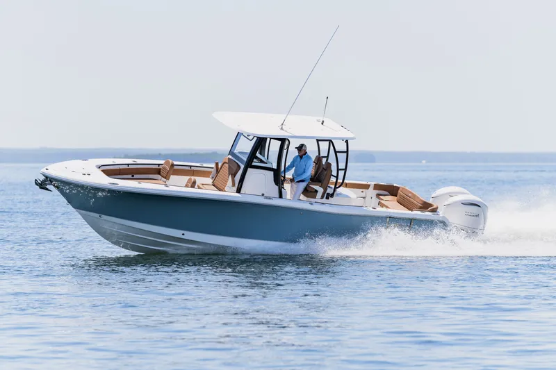 Slide: The Image of 2026 Sea Hunt Ultra 305SE cruising on open water, showcasing sleek design and performance. - 35