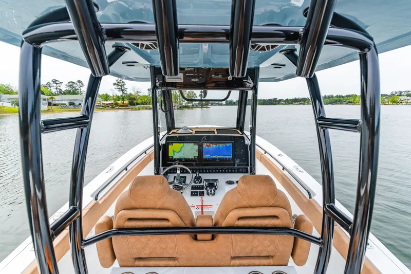 Slide: The Image of Interior view of 2026 Sea Hunt Ultra 305SE boat with advanced navigation system. - 12