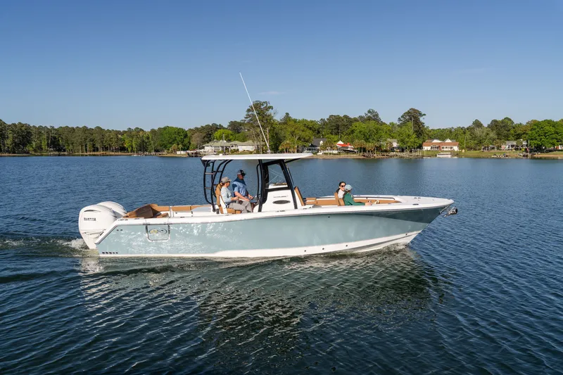 Slide: The Image of 2026 Sea Hunt Ultra 305SE boat cruising on a serene lake. - 37