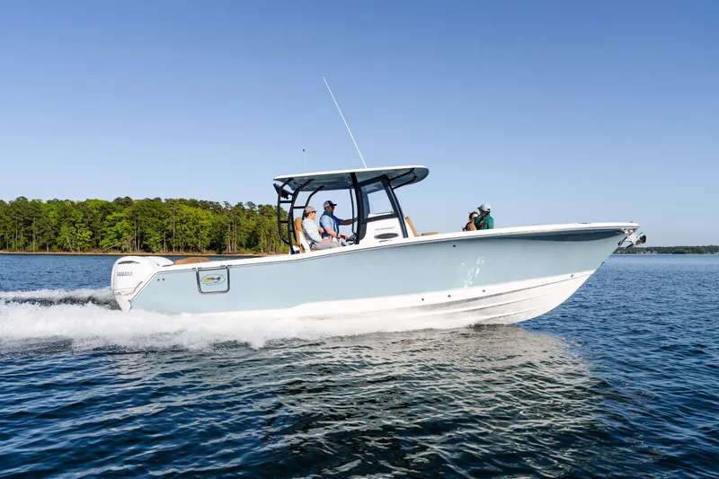 Slide: The Image of 2026 Sea Hunt Ultra 305SE boat cruising on a serene lake. - 40