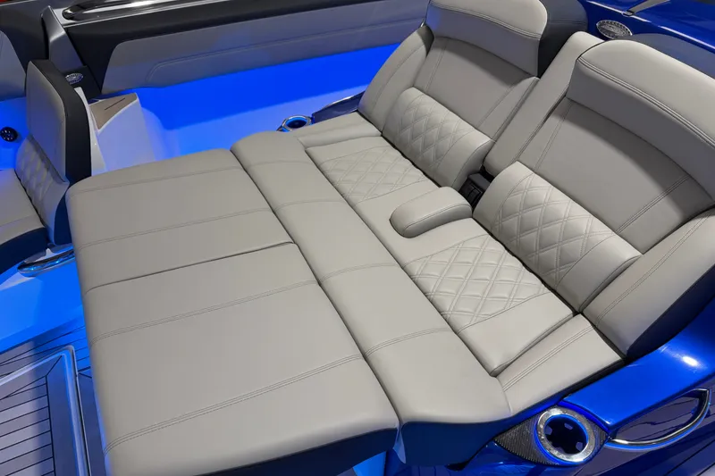 Slide: The Image of Luxurious seating in the 2027 Nor-Tech 450 Sport boat with elegant blue LED lighting. - 24