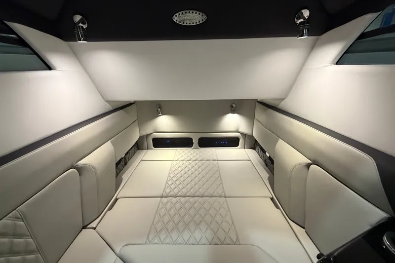 Slide: The Image of Luxurious interior of 2027 Nor-Tech 450 Sport boat with elegant lighting and plush seating. - 50