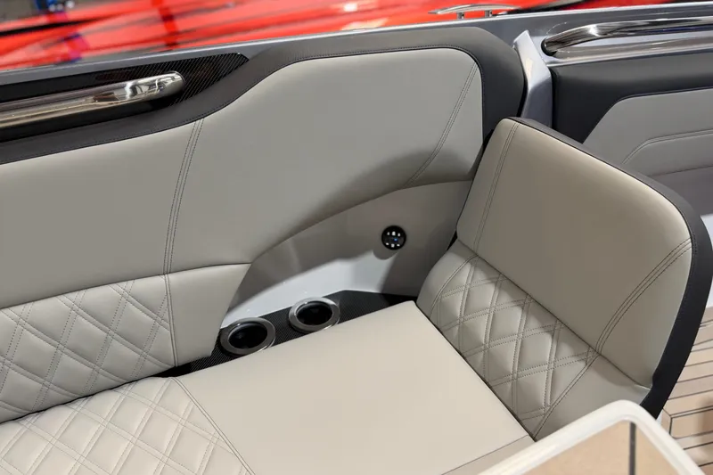 Slide: The Image of Luxurious interior seating of 2027 Nor-Tech 450 Sport boat with quilted upholstery. - 20