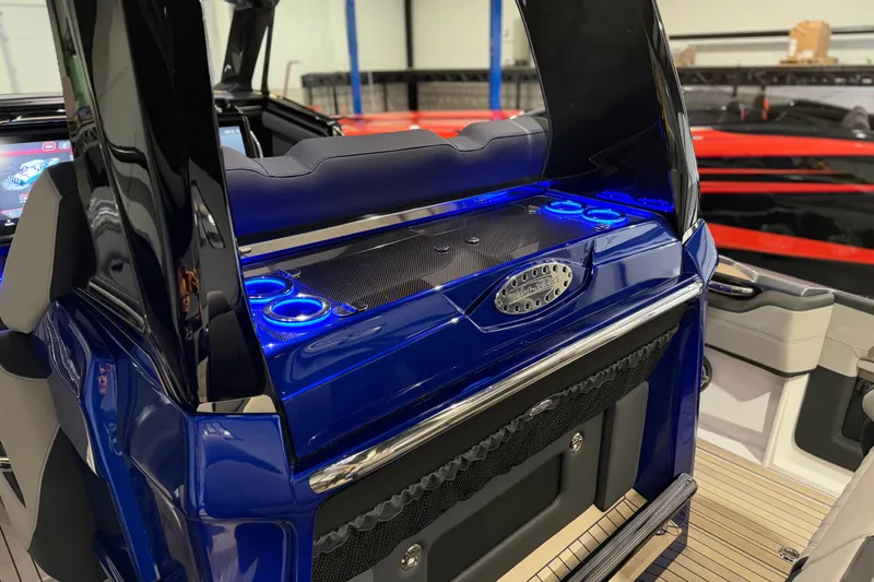 Slide: The Image of 2027 Nor-Tech 450 Sport boat interior with illuminated blue accents and sleek design. - 38