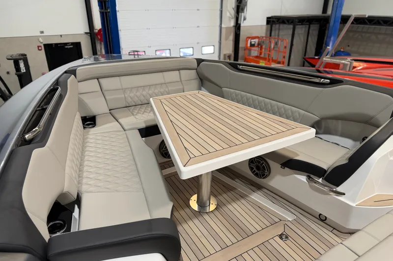 Slide: The Image of Luxurious seating area on a 2027 Nor-Tech 450 Sport boat with elegant wood table. - 17