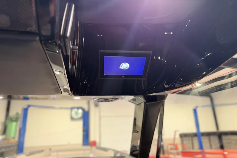 Slide: The Image of 2027 Nor-Tech 450 Sport boat interior with digital display screen. - 34
