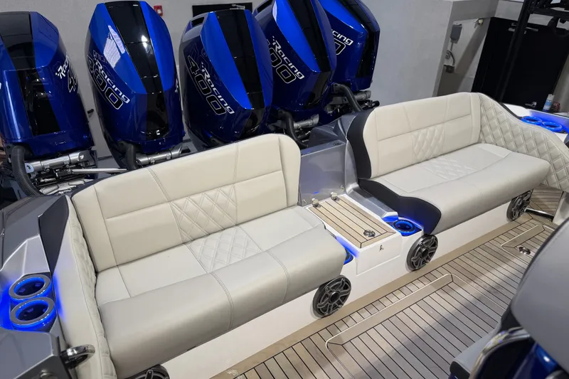 Slide: The Image of Luxury seating on 2027 Nor-Tech 450 Sport boat with powerful outboard engines. - 44