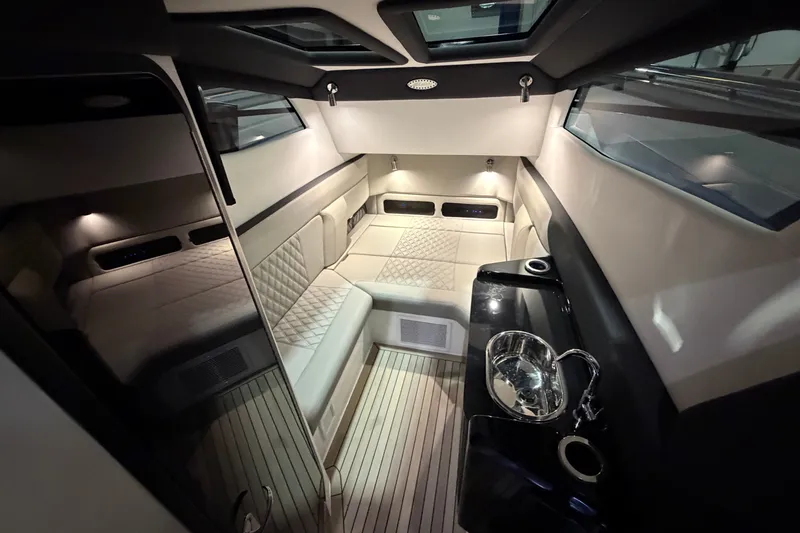 Slide: The Image of Luxurious interior of 2027 Nor-Tech 450 Sport boat with elegant seating and modern amenities. - 49