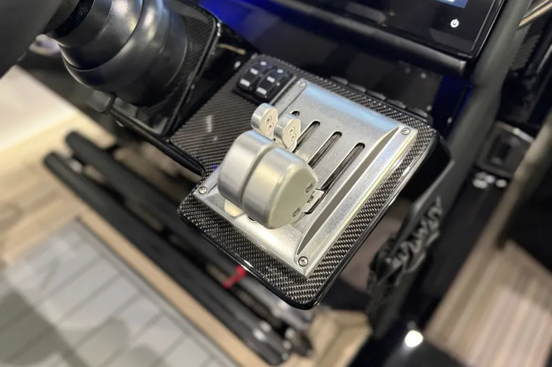 Slide: The Image of Close-up of 2027 Nor-Tech 450 Sport throttle controls with carbon fiber finish. - 30