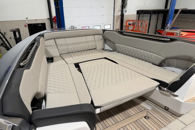 Slide: The Image of Luxurious seating area on 2027 Nor-Tech 450 Sport boat with quilted upholstery. - 18