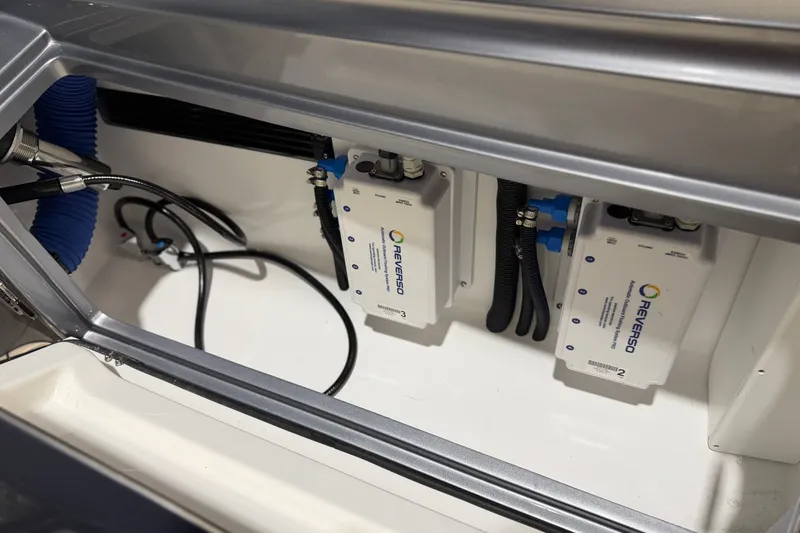 Slide: The Image of Engine compartment of 2027 Nor-Tech 450 Sport featuring Reverso pumps and wiring. - 56