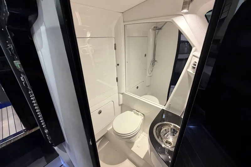 Slide: The Image of Luxurious bathroom interior of 2027 Nor-Tech 450 Sport boat, featuring modern fixtures and sleek design. - 54