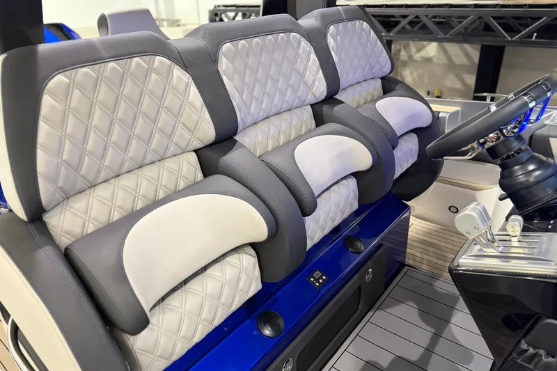 Slide: The Image of Luxury seating in 2027 Nor-Tech 450 Sport boat with quilted upholstery and modern design. - 36