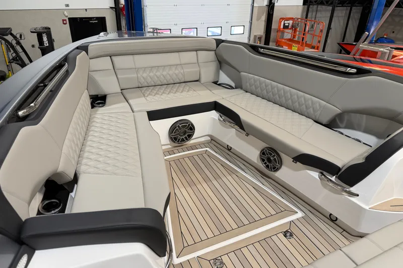 Slide: The Image of Luxurious seating area of 2027 Nor-Tech 450 Sport boat with elegant upholstery and speakers. - 19