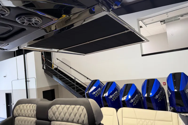 Slide: The Image of 2027 Nor-Tech 450 Sport boat interior with powerful Racing 400 engines, luxurious seating, and sleek design. - 46
