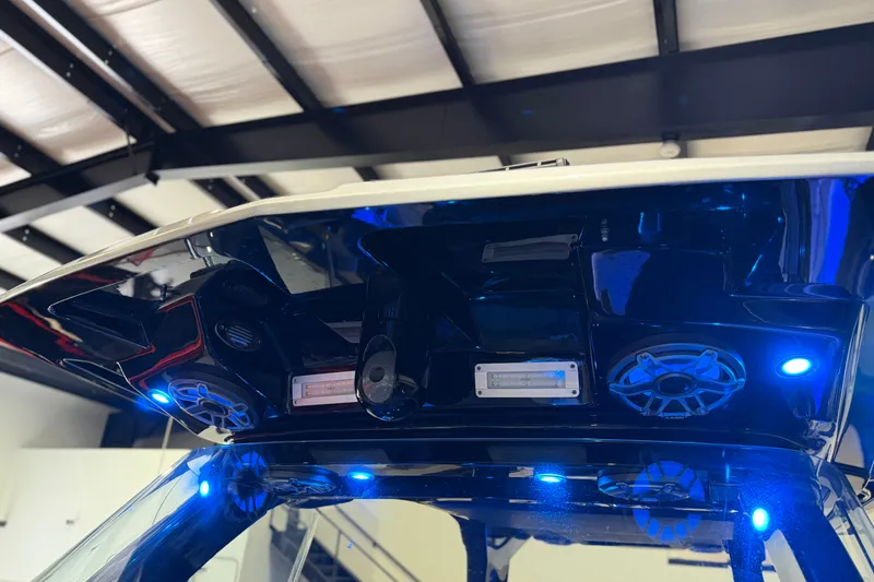 Slide: The Image of 2027 Nor-Tech 450 Sport boat with illuminated speakers and modern design features. - 28