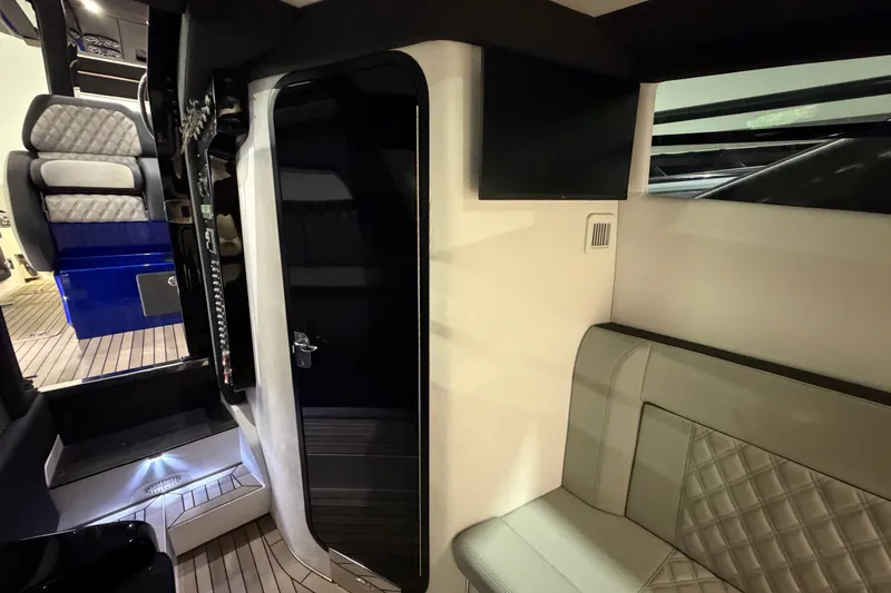 Slide: The Image of Interior of 2027 Nor-Tech 450 Sport boat, featuring luxurious seating and modern design. - 53