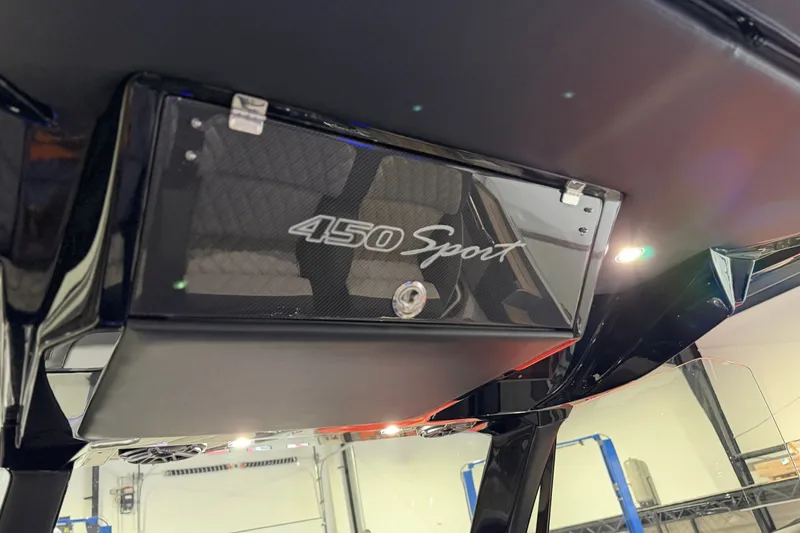 Slide: The Image of 2027 Nor-Tech 450 Sport boat interior detail with sleek black finish and modern lighting. - 33