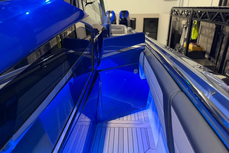 Slide: The Image of Sleek blue interior of 2027 Nor-Tech 450 Sport boat with modern design elements. - 27