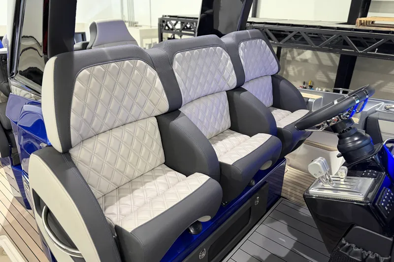 Slide: The Image of Luxurious seating in the 2027 Nor-Tech 450 Sport boat, featuring diamond-stitched upholstery. - 35