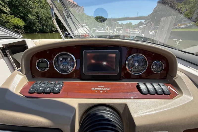 Slide: The Image of Dashboard of a 2011 Regal 2700 ES Bowrider with gauges and controls. - 17