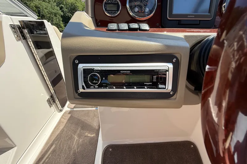Slide: The Image of 2011 Regal 2700 ES Bowrider dashboard with Kenwood stereo system. - 18