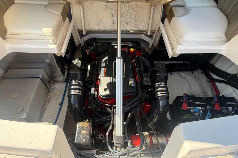 Slide: The Image of Engine compartment of a 2011 Regal 2700 ES Bowrider with visible components and batteries. - 35