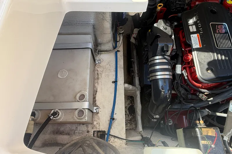 Slide: The Image of Engine compartment of a 2011 Regal 2700 ES Bowrider, showcasing mechanical components. - 37