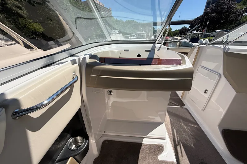 Slide: The Image of Interior view of a 2011 Regal 2700 ES Bowrider boat, showcasing helm and seating area. - 20