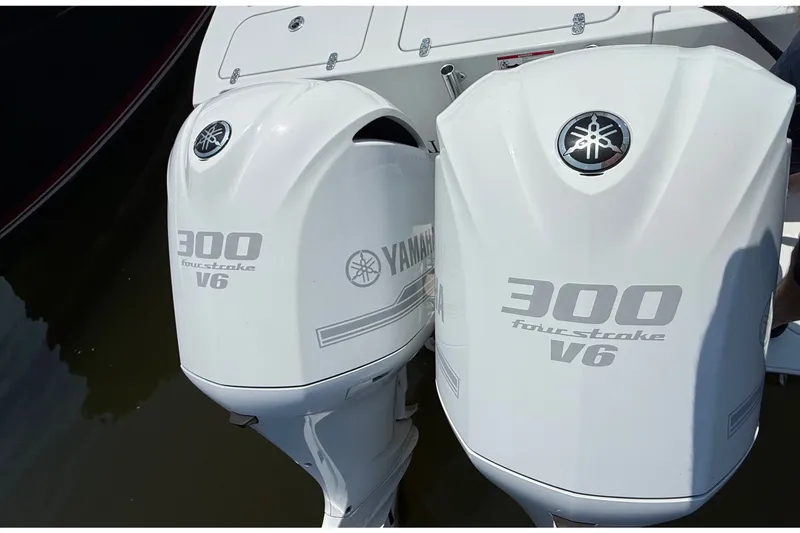 Slide: The Image of Two Yamaha 300 HP V6 outboard engines on a 2017 Contender 32 ST boat. - 16