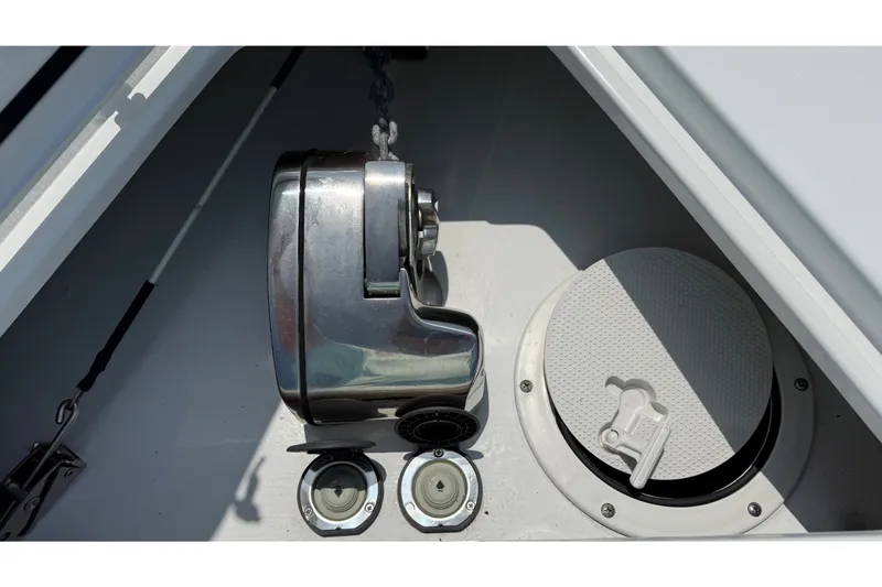 Slide: The Image of Close-up of an anchor locker with a windlass and two covers. - 18