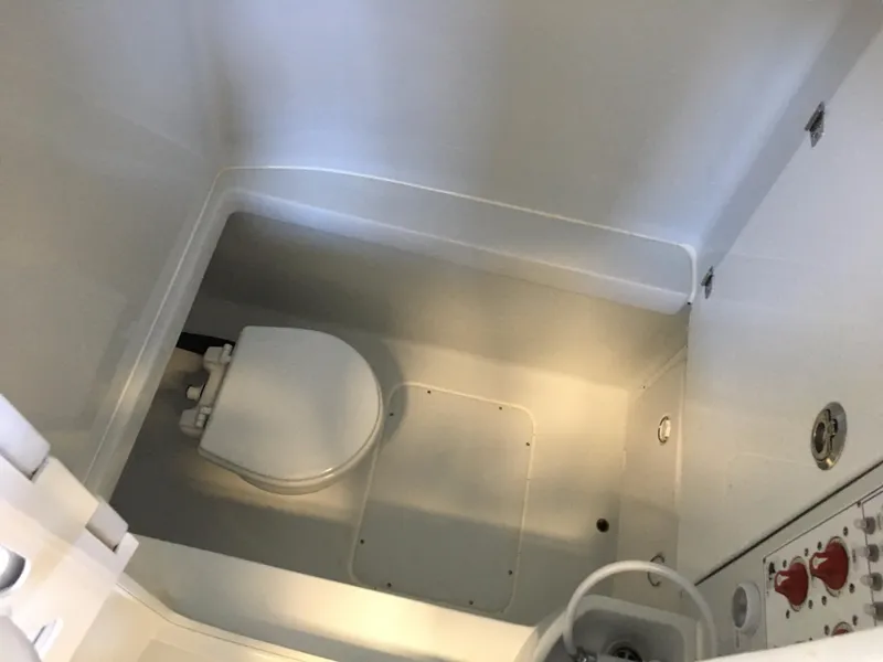 Slide: The Image of Interior view of a boat bathroom with a toilet and fixtures. - 31