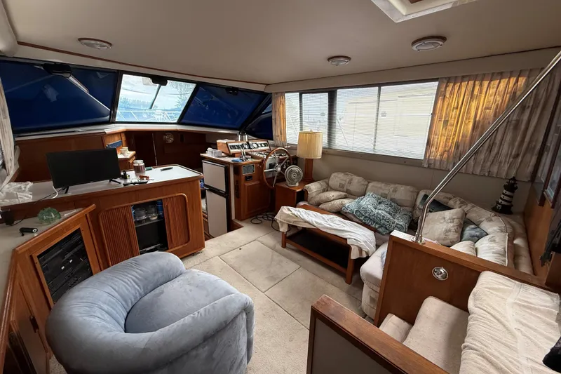 Slide: The Image of Interior of 1988 Carver 38 Aft Cabin Motor Yacht with cozy seating and helm station. - 34