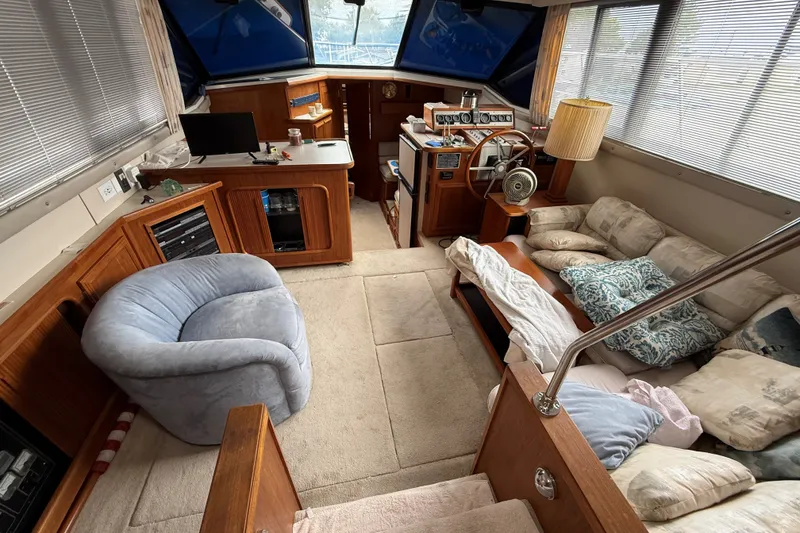 Slide: The Image of Interior of 1988 Carver 38 Aft Cabin Motor Yacht with cozy seating and helm. - 25