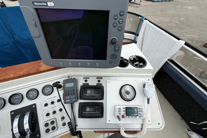 Slide: The Image of Control panel of a 1988 Carver 38 Aft Cabin Motor Yacht with navigation equipment. - 17