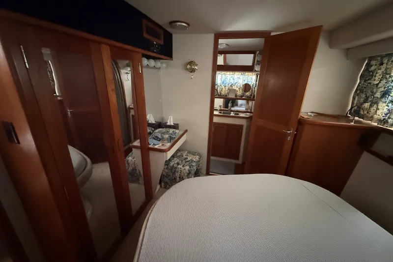 Slide: The Image of Interior of 1988 Carver 38 Aft Cabin Motor Yacht with wood finishes and cozy decor. - 30