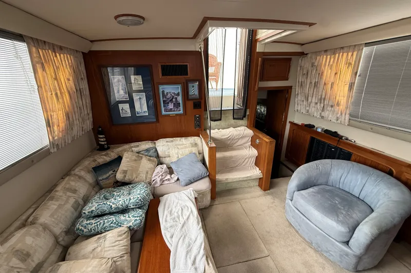 Slide: The Image of Interior of 1988 Carver 38 Aft Cabin Motor Yacht with cozy seating and decor. - 27