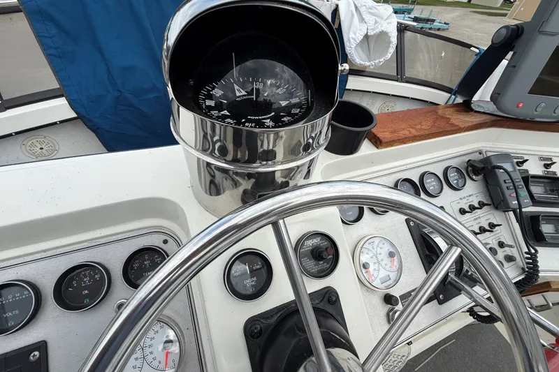Slide: The Image of Helm of 1988 Carver 38 Aft Cabin Motor Yacht with compass and gauges. - 20