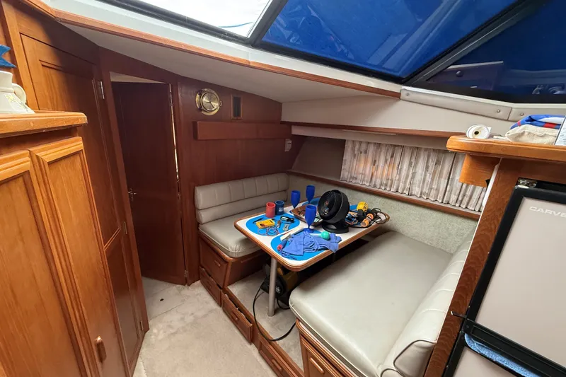 Slide: The Image of Interior of 1988 Carver 38 Aft Cabin Motor Yacht with seating and table. - 37